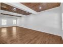 Open-concept living room with hardwood floors and wood-look ceiling at 552 Steels Bridge Rd, Canton, GA 30114