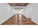 Spacious open-concept living room with windows and wood-look ceiling at 552 Steels Bridge Rd, Canton, GA 30114