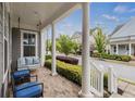 Relaxing front porch with comfortable seating and a swing, perfect for enjoying the neighborhood view at 4020 Declaration Dr, Roswell, GA 30076
