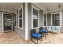 Charming front porch featuring a swing, seating, and a welcoming entrance to the home at 4020 Declaration Dr, Roswell, GA 30076