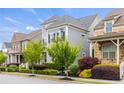 Street view of beautiful homes with manicured lawns, trees, and well-maintained landscaping at 4020 Declaration Dr, Roswell, GA 30076