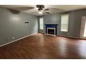 Spacious living room with a ceiling fan and fireplace at 4341 Savannah Ln, Atlanta, GA 30349