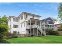 Back exterior of a beautiful home featuring a well-kept lawn, and a back balcony at 519 2Nd Ave, Decatur, GA 30030