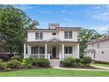 Inviting two-story home with a classic front porch and lush green lawn at 519 2Nd Ave, Decatur, GA 30030