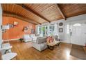 Bright living room featuring hardwood floors, exposed beam ceilings, and a cozy seating arrangement at 1188 Cedar Park Cir, Stone Mountain, GA 30083