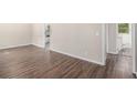 Spacious living room area with hardwood flooring, showcasing a clean and neutral color palette at 261 Hemphill School Nw Rd, Atlanta, GA 30331