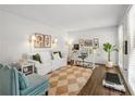 Cozy living room features a comfortable seating area, a stylish desk, and natural light at 4257 Edgewater Nw Dr, Kennesaw, GA 30144
