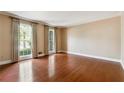 Spacious living room with hardwood floors and large windows at 3200 Turtle Lake Se Ct, Marietta, GA 30067
