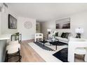 Cozy living room featuring modern decor, comfortable seating, contemporary artwork, and a stylish bar area at 120 Alden Nw Ave # D2, Atlanta, GA 30309