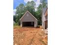 The open garage awaits your custom touches in this new construction home at 879 Highway 101 N, Dallas, GA 30157