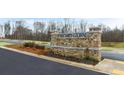 Stone entrance sign for Echo Glen featuring manicured landscaping and a well-maintained surrounding area at 460 Reflection Dr # 21, Stockbridge, GA 30281