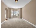 Carpeted bonus room with bay window provides plenty of natural light and space at 4499 Bellemeade Dr, Douglasville, GA 30135