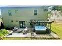 Relaxing backyard with a hot tub and cozy seating area perfect for outdoor entertaining at 109 Red Fox Dr, Dallas, GA 30157