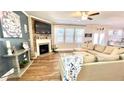 Spacious living room with a fireplace, hardwood floors and lots of natural light at 109 Red Fox Dr, Dallas, GA 30157
