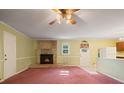 Inviting living room featuring a brick fireplace, soft lighting, and classic finishes at 723 Monticello Se Way, Marietta, GA 30067