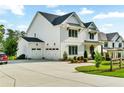 Spacious three-car garage with an extended driveway and landscaped yard at 2201 Old Dallas Sw Rd, Marietta, GA 30064