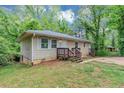 Quaint single-story residence offers a blend of classic charm and natural surroundings at 2952 Mcafee Rd, Decatur, GA 30032