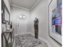 Stylish entryway featuring wood-look floors, elegant decor, and neutral paint colors for a welcoming ambiance at 130 Maple Creek Way, Woodstock, GA 30188