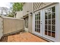 Private brick patio with french doors at 2302 Colonial Ne Dr, Brookhaven, GA 30319
