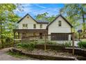 Charming two-story home with a welcoming front porch and well-maintained landscaping at 4614 Riveredge Cv, Snellville, GA 30039