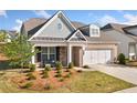 Attractive home featuring a brick facade, siding accents, well-maintained lawn, and a two-car garage at 503 Forest Ln, Canton, GA 30114