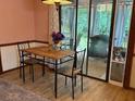 Dining area with table, chairs, and access to the patio and backyard at 3876 Winners Ct, Marietta, GA 30062