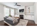 Cozy living room with fireplace, built-in shelves, and modern ceiling fan at , Atlanta, GA 30316