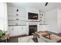 Bright and spacious living room features a fireplace and built-in shelving at , Atlanta, GA 30316