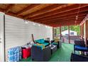 Relaxing screened porch with comfortable seating and string lights at 164 Chickasaw Ln, Austell, GA 30168
