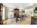 Formal dining room featuring a dark wood table and classic decor at 5452 Tally Green Dr, Marietta, GA 30068