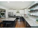 Modern eat-in kitchen featuring granite countertops, stainless steel appliances, and a center island with seating at 1907 Shalimar Ne Dr, Atlanta, GA 30345