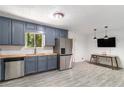 Updated kitchen featuring modern appliances, stylish cabinets, butcher block countertops, and a dining area at 240 Wellington Dr, Mcdonough, GA 30252
