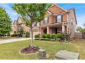 Beautiful home with a lush green lawn and mature landscaping, creating a welcoming and picturesque setting at 3259 Baylor Cir, Mcdonough, GA 30253