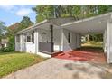 Inviting single-story house featuring a covered carport, fresh paint, and a cozy front porch at 3406 Jackson Dr, Decatur, GA 30032