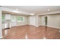Open-concept living space with wood floors, updated kitchen, stainless steel appliances, and natural light at 429 Landers Dr, Mableton, GA 30126