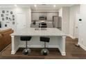 Modern kitchen with stainless steel appliances and large island at 3407 Hidden Stream Ct, Stockbridge, GA 30281