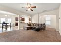 Open-concept living room featuring plush carpeting, neutral walls, and an abundance of natural light at 517 Dasheill Ln, Atlanta, GA 30349