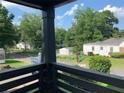 View from the covered porch looking out over the yard and neighborhood at 1298 Gideons Sw Dr, Atlanta, GA 30314