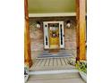 Charming front door with brick exterior, wreath, and striped mat welcomes you home at 2870 Willow Wisp Way, Cumming, GA 30040