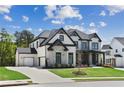 Beautiful two-story home with a side-entry garage, manicured lawn, and covered front porch at 2977 Treeside Ter, Marietta, GA 30066