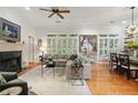 Spacious living room featuring a fireplace, hardwood floors, and natural light at 104 Glentown Way, Sandy Springs, GA 30328