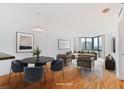 Staged living room features hardwood floors, a comfortable seating area, and natural light at 2870 Pharr Court South Nw # 1704, Atlanta, GA 30305