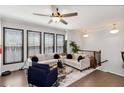 Inviting living room features hardwood floors, a ceiling fan, and a staircase at 371 Northaven Ave, Suwanee, GA 30024