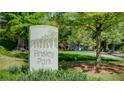 Ansley Park neighborhood sign with mature trees and lush greenery at 470 Ansley Walk Ne Ter, Atlanta, GA 30309