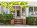 Inviting front entrance with brick steps and a covered porch, perfect for relaxing at 77 Glenn Se St, Atlanta, GA 30312