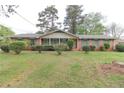 Traditional brick home with a covered porch and lush front yard, providing a classic and welcoming exterior at 3257 Greenvale Way, Decatur, GA 30034