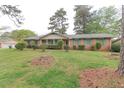 Lovely brick home with a charming front porch and beautifully landscaped yard, offering a warm and inviting setting at 3257 Greenvale Way, Decatur, GA 30034