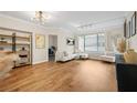 Open-concept living room with modern lighting, neutral decor, and sleek flooring at 3481 Lakeside Dr # 601, Atlanta, GA 30326