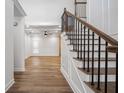 Inviting foyer with hardwood floors and a staircase with a dark metal railing at 3850 Laurel Nw Dr, Acworth, GA 30101