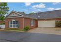Beautiful brick home with an attached garage and well-maintained landscaping at 509 Sawnee Corners Dr, Cumming, GA 30040
